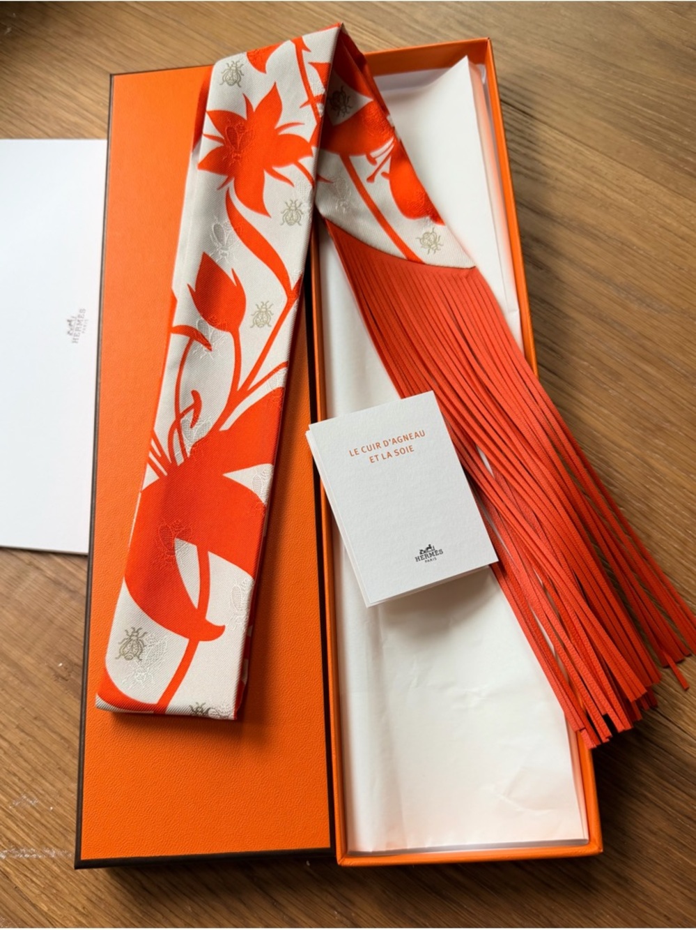 Hermès Orange and White Silk Twilly with Floral Motif Authentic